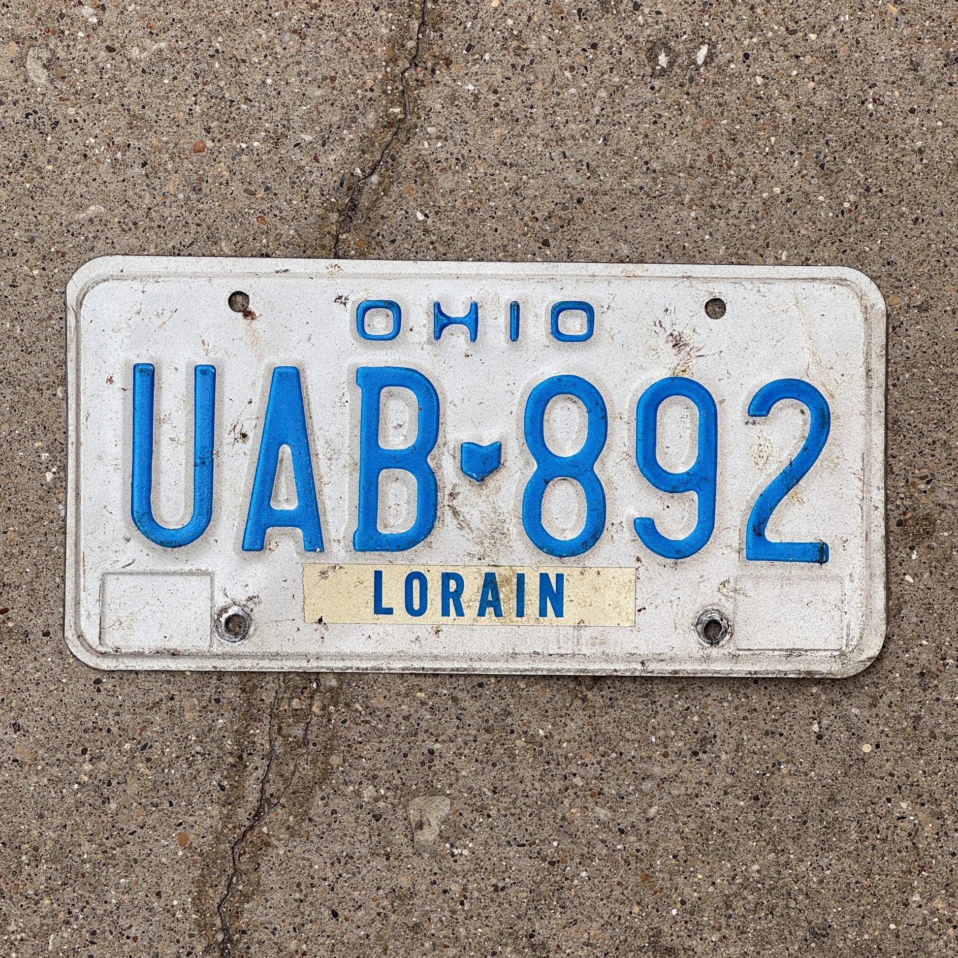 Photo of a 1980 Ohio License Plate Auto Tag 1 Vintage Garage UAB 892 with original patina