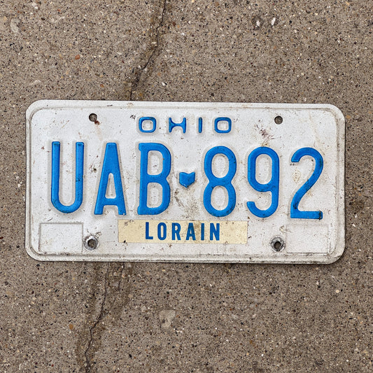 Photo of a 1980 Ohio License Plate Auto Tag 1 Vintage Garage UAB 892 with original patina