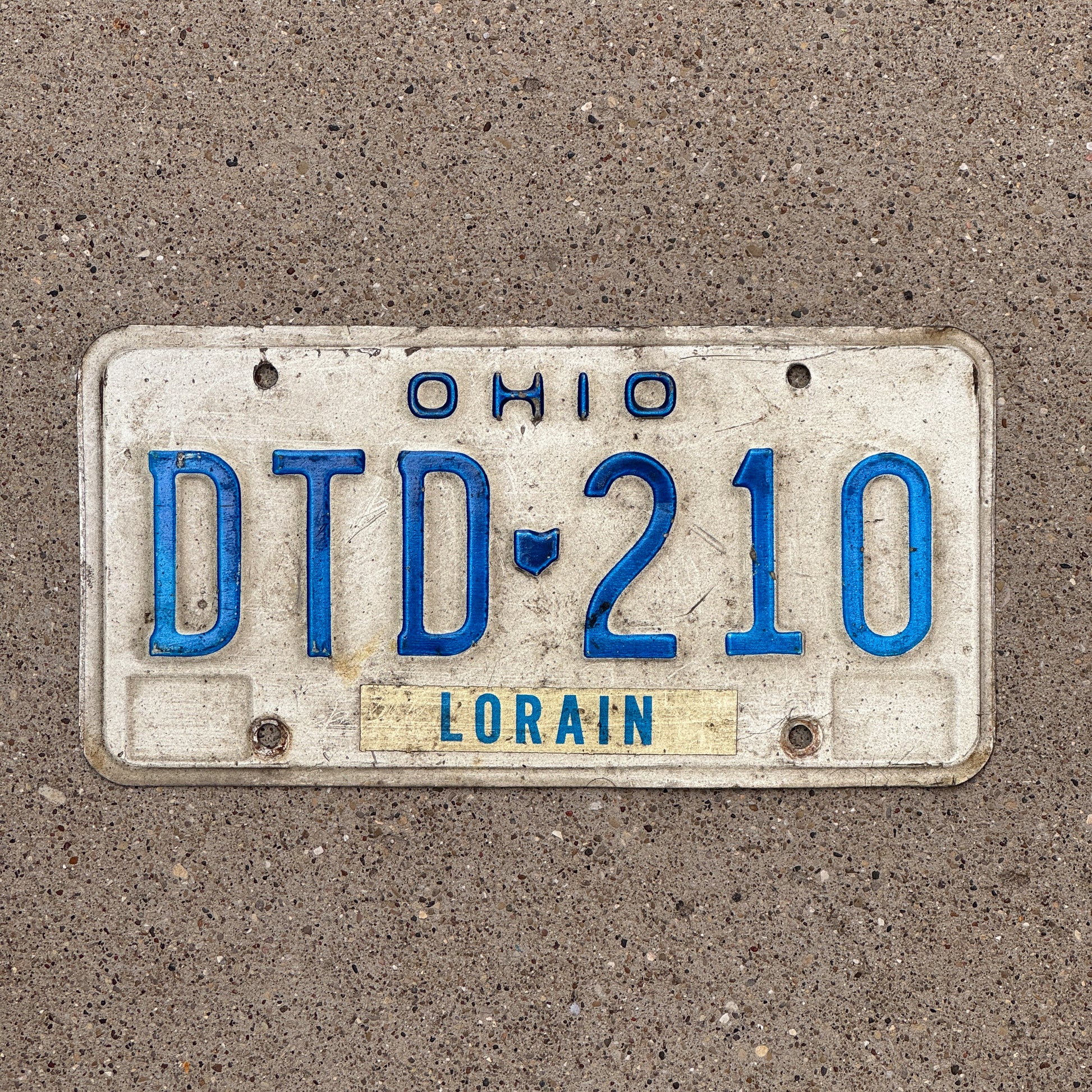 Photo of a 1980 Ohio License Plate Auto Tag 2 Vintage Garage DTD 210 with original patina