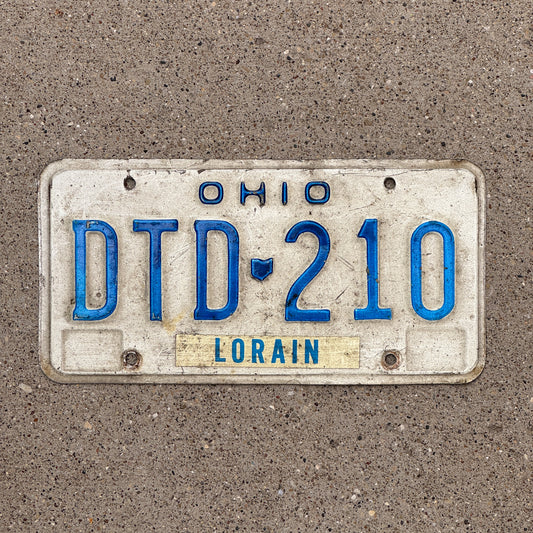 Photo of a 1980 Ohio License Plate Auto Tag 2 Vintage Garage DTD 210 with original patina