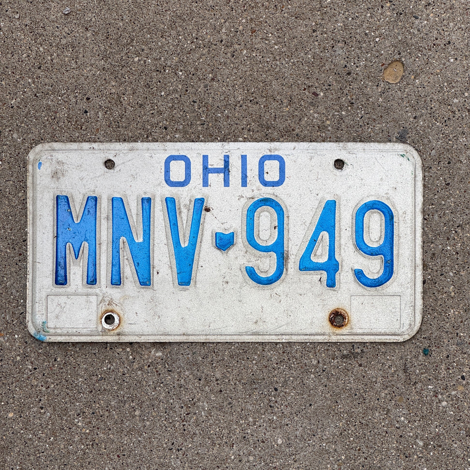 Photo of a 1980 Ohio License Plate Auto Tag 2 Vintage Garage MNV 949 with original patina