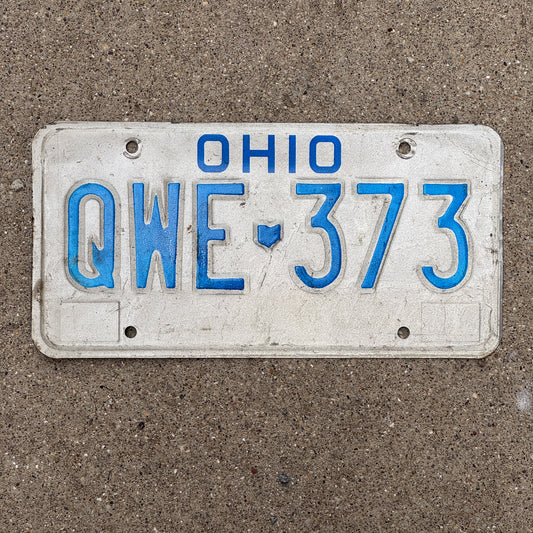 Photo of a 1980 Ohio License Plate Auto Tag 2 Vintage Garage QWE 373 with original patina