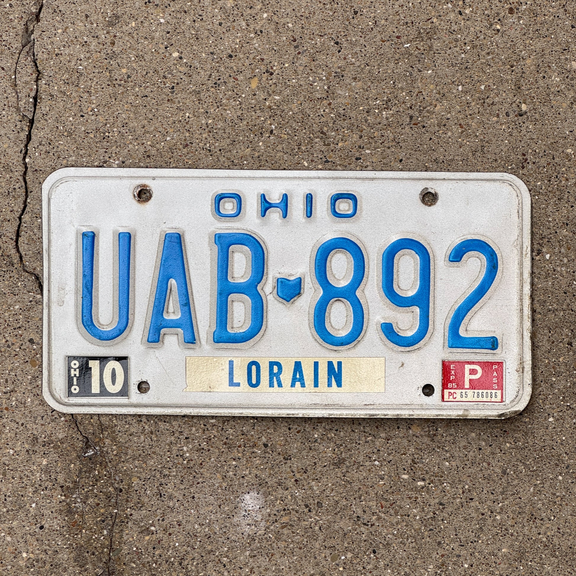 Photo of a 1980 Ohio License Plate Auto Tag 2 Vintage Garage UAB 892 with original patina