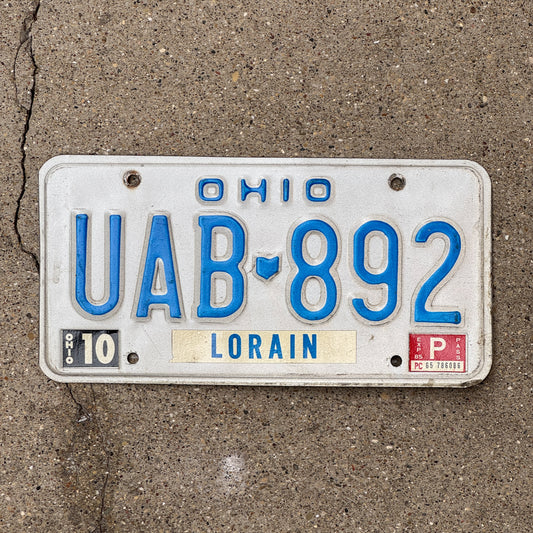 Photo of a 1980 Ohio License Plate Auto Tag 2 Vintage Garage UAB 892 with original patina