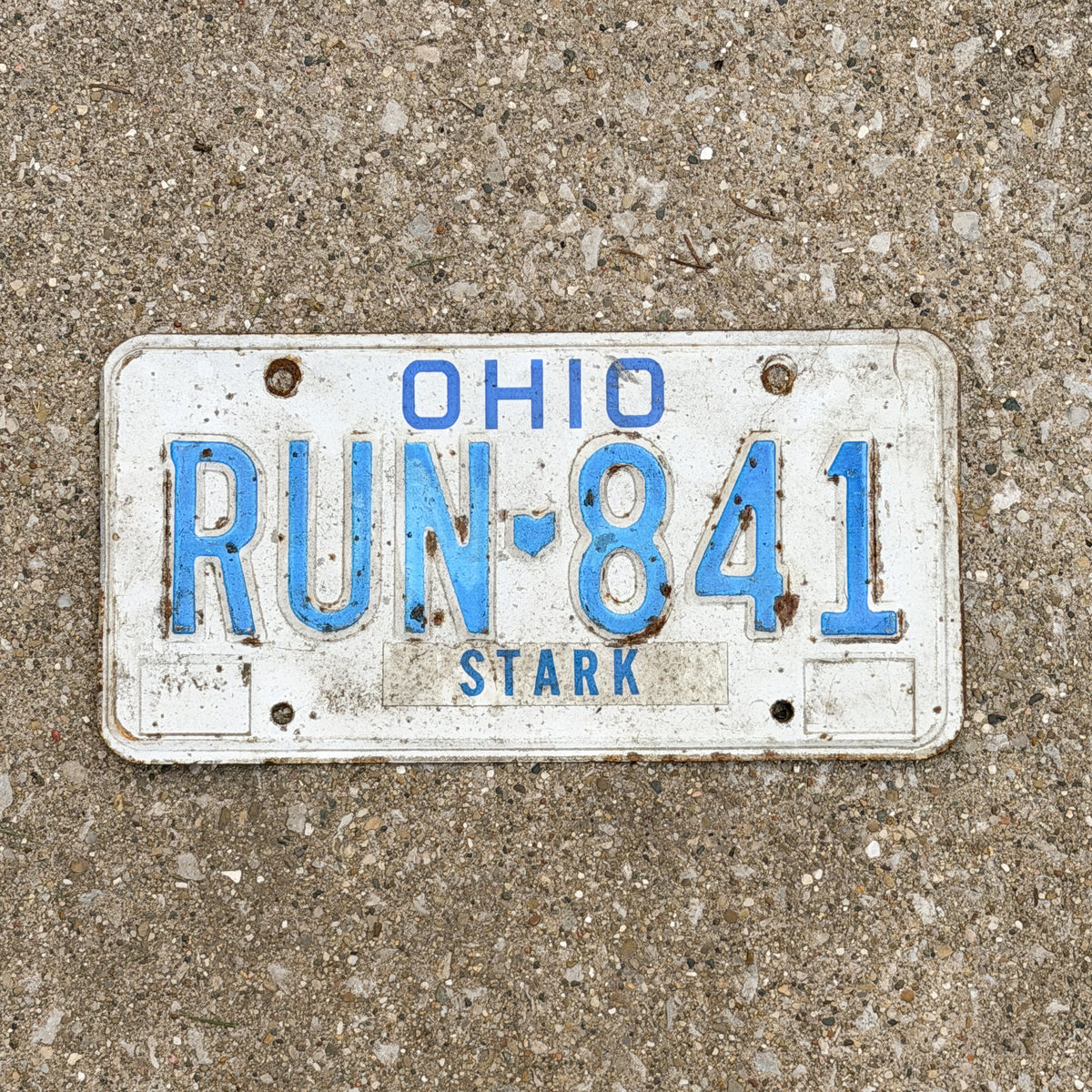 Photo of a 1980 Ohio License Plate Auto Tag 2 Vintage RUN 841 with original patina