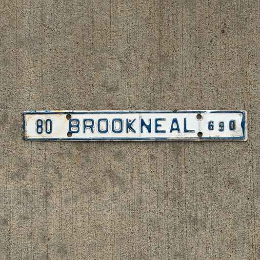 Photo of a 1980 Virginia Tax Strip License Plate Auto Tag Garage Decor Vintage Brookneal 690 with original patina