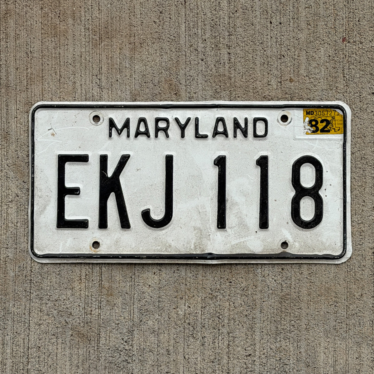 Photo of a 1981 1982 Maryland License Plate Auto Tag Garage Decor Vintage EKJ 118 with original patina