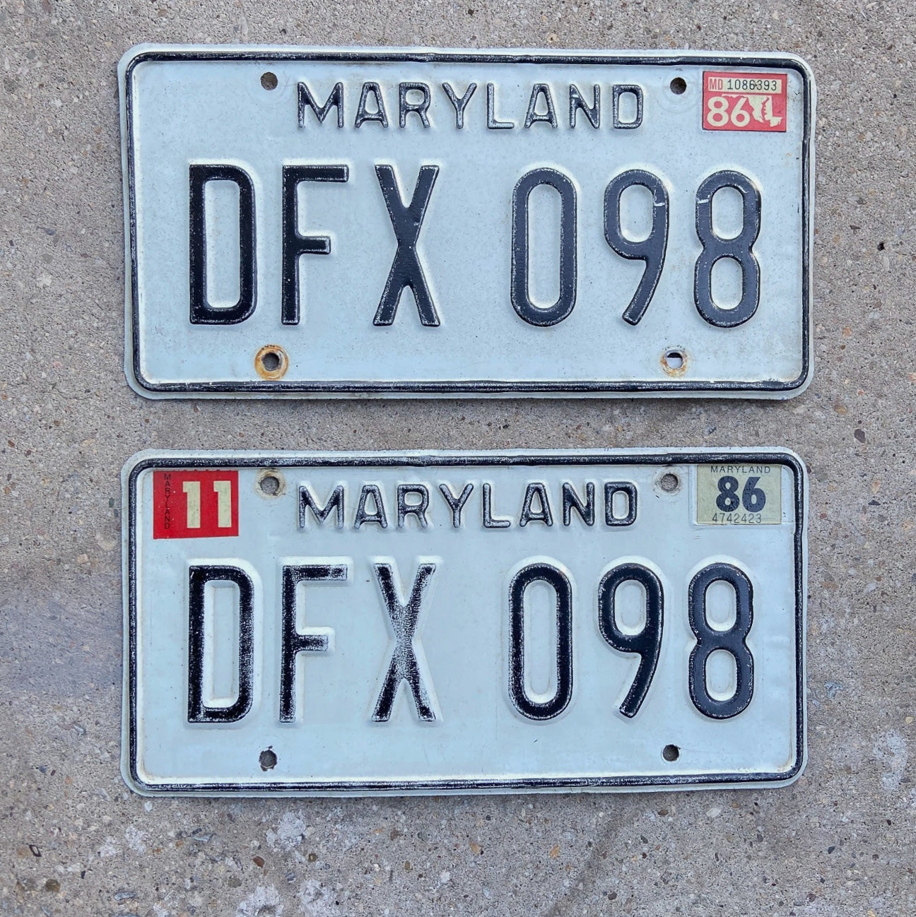 Photo of a 1981 1986 Maryland License Plate Pair Auto Tag Garage Decor Vintage DFX 098 with original patina