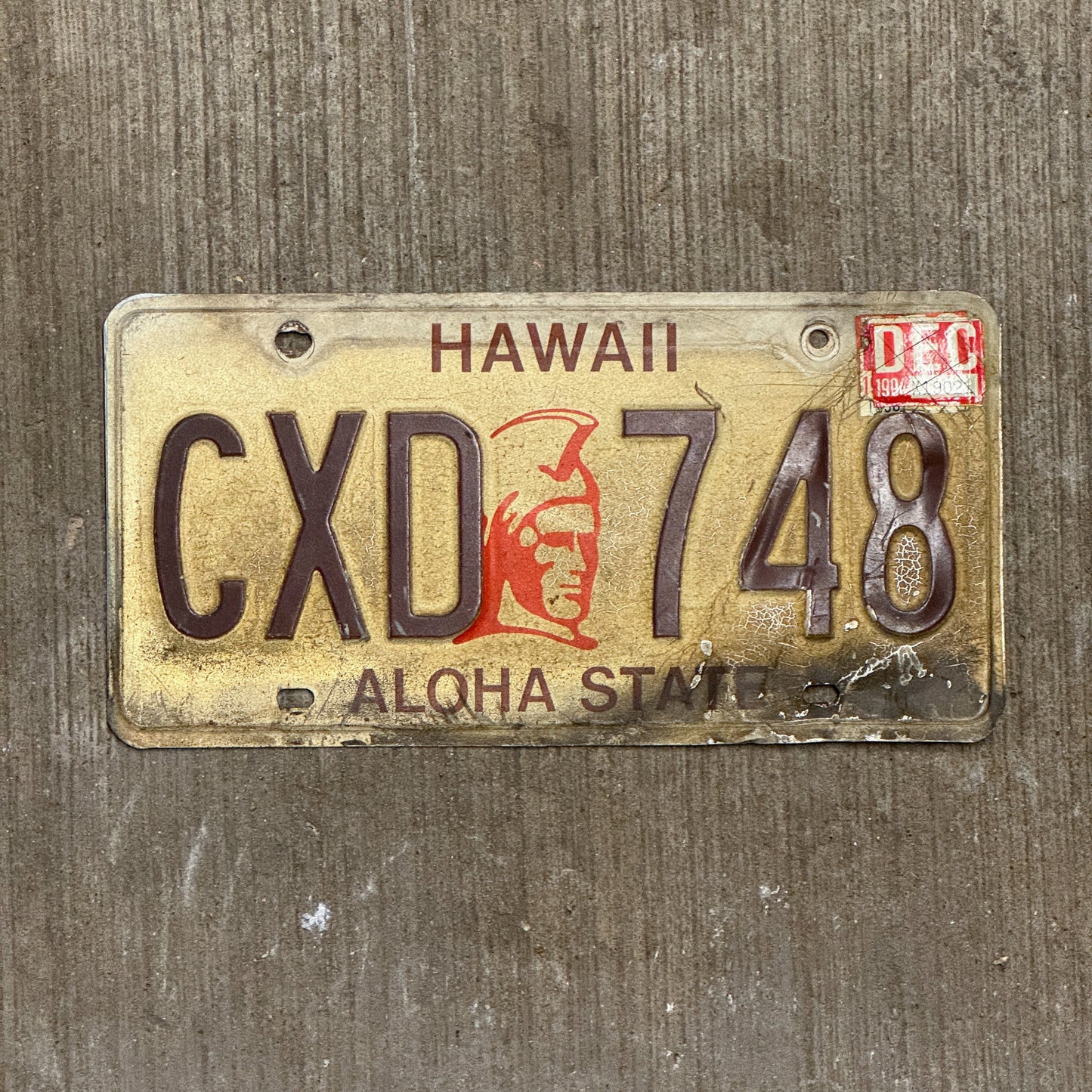 Photo of a 1981 1994 Hawaii Auto Tag Garage Decor Vintage Kamehameha CXD 748 with original patina