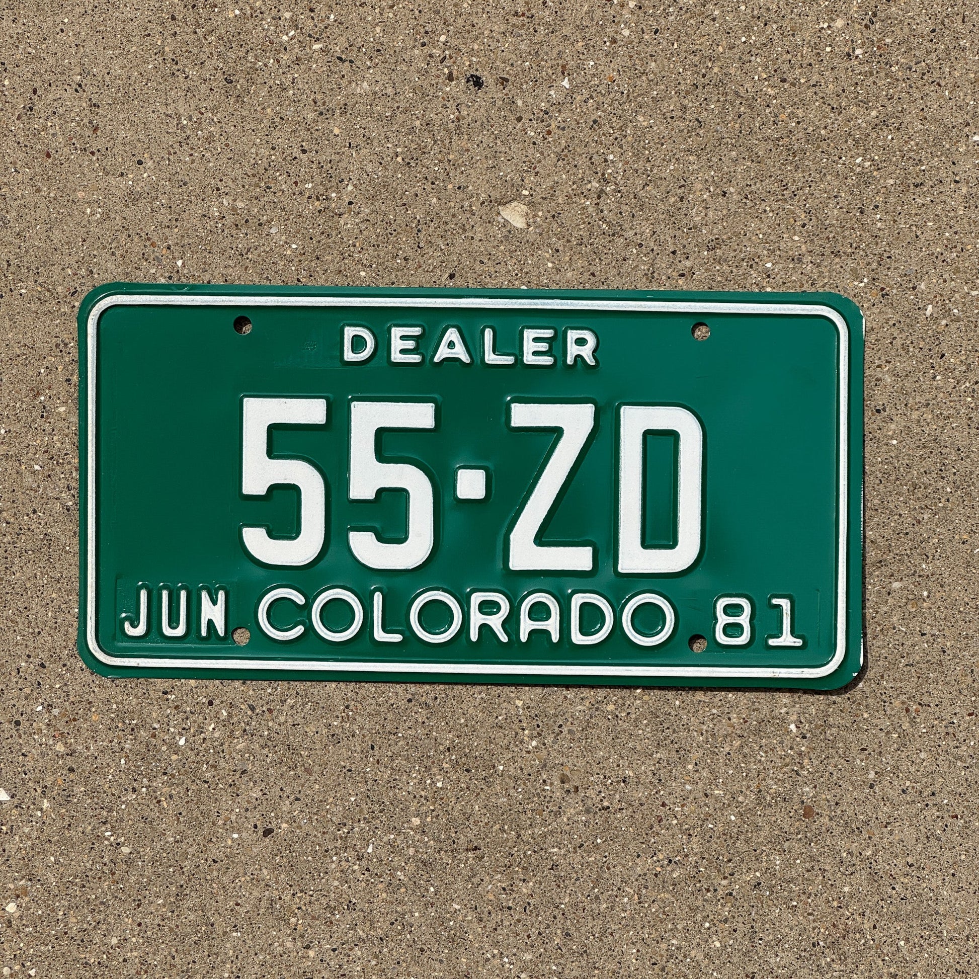 Photo of a 1981 Colorado Dealer License Plate Auto Tag Garage Decor Vintage 55 ZD