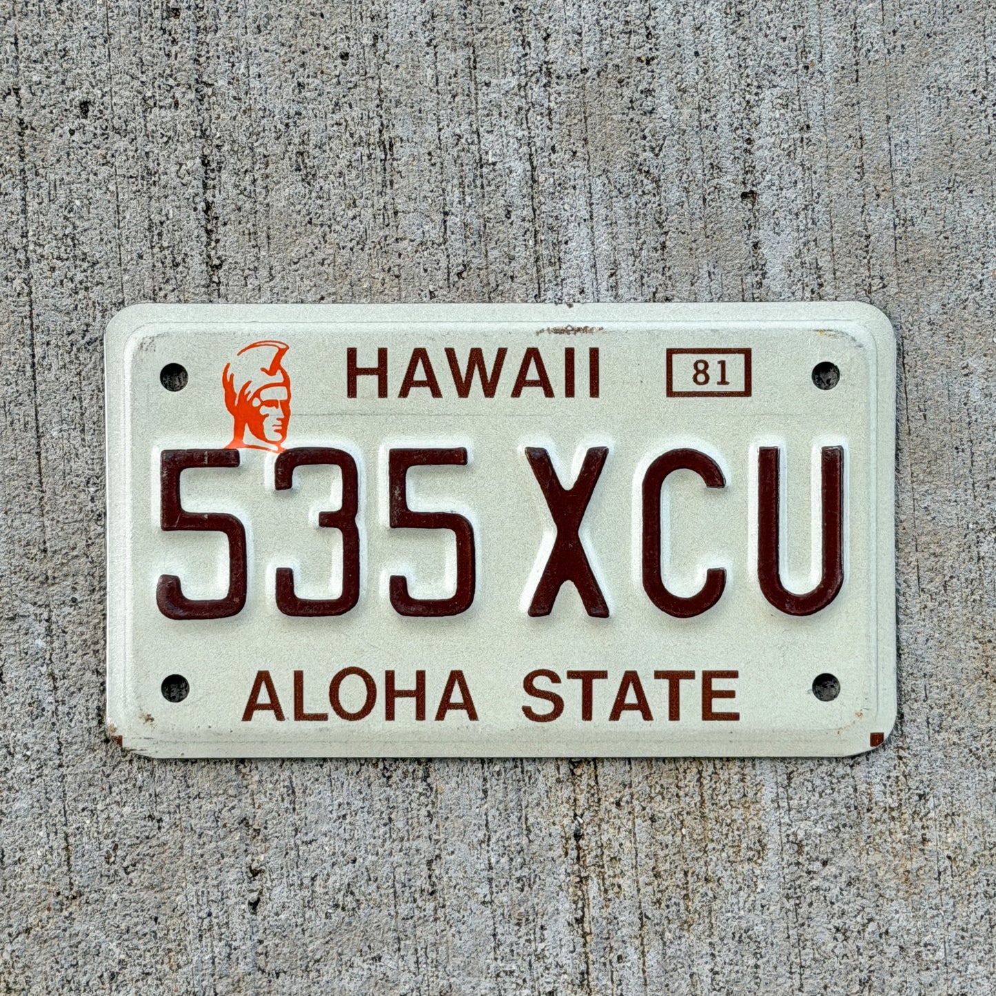Photo of a 1981 Hawaii Motorcycle License Plate Auto Tag Garage Decor Vintage King Kamehameha 535 XCU with original patina