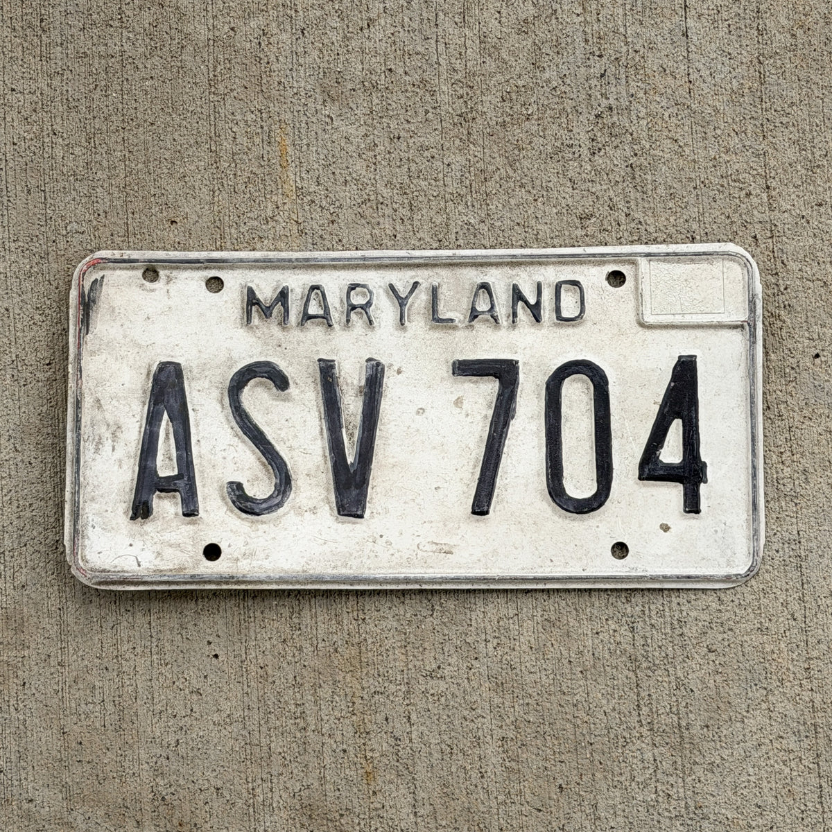 Photo of a 1981 Maryland License Plate Auto Tag Garage Decor Vintage ASV 704 with original patina