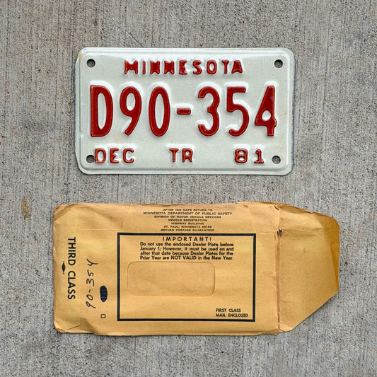 Photo of a 1981 Minnesota Trailer Dealer License Plate Auto Tag Garage Decor Vintage NOS with Envelope D90 354 with original patina