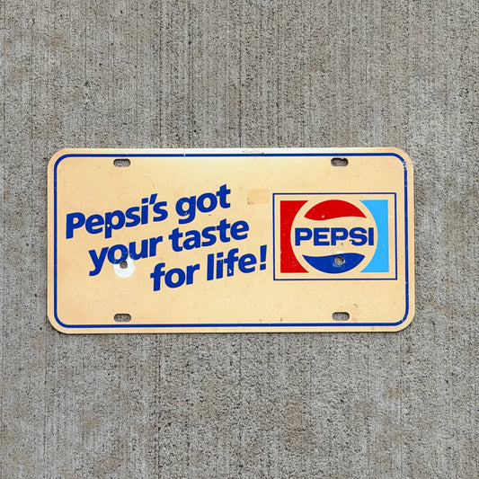 Photo of a 1981 Pepsi's Got Your Taste For Life Booster License Plate Auto Tag Garage Decor Vintage Plastic Sode Pop Collectible with original patina