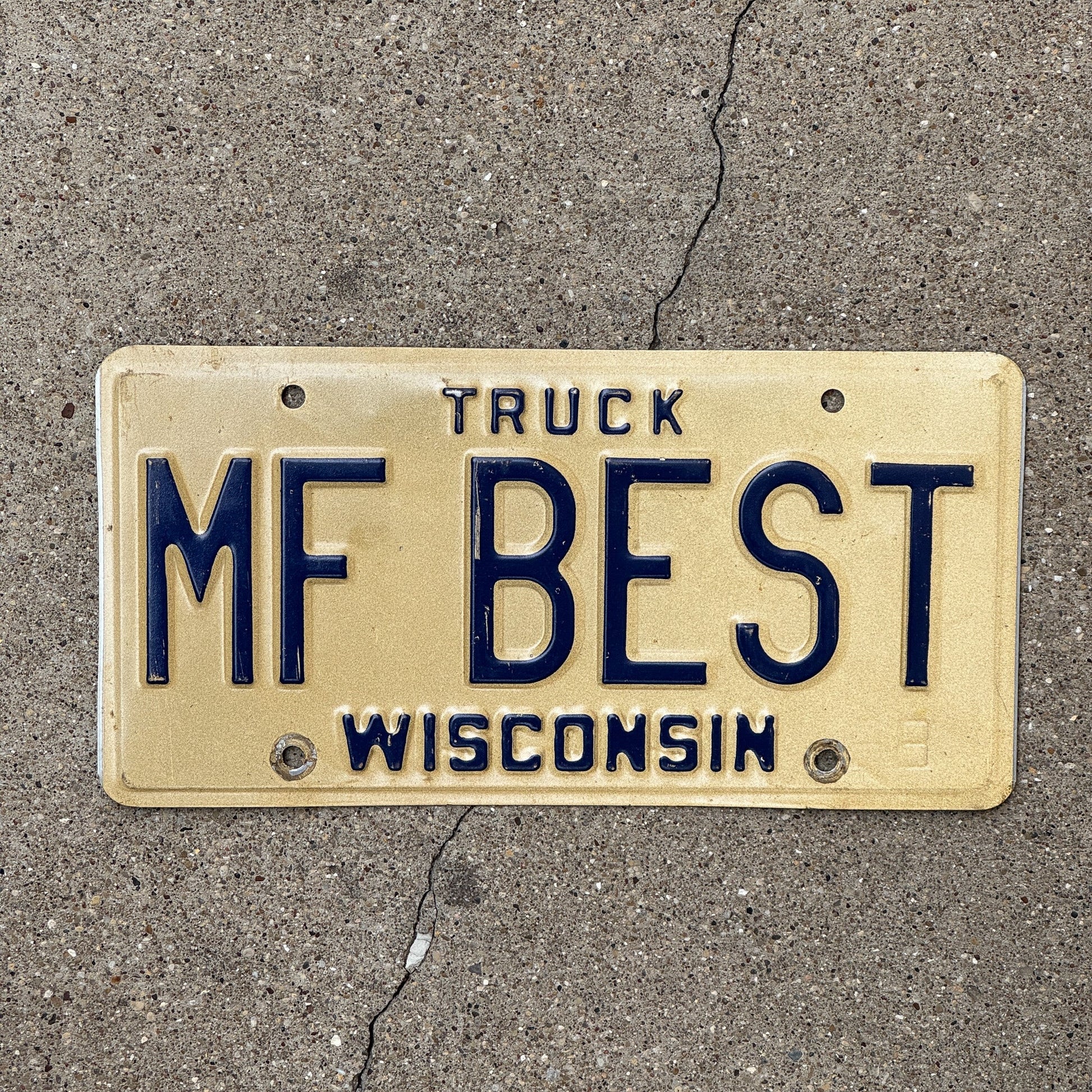 Photo of a 1981 Wisconsin Vanity License Plate Auto Tag Garage Decor Vintage Truck Mother F MF BEST with original patina