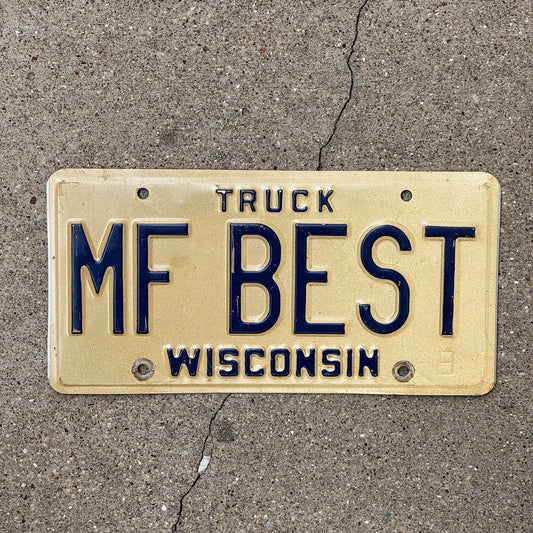 Photo of a 1981 Wisconsin Vanity License Plate Auto Tag Garage Decor Vintage Truck Mother F MF BEST with original patina