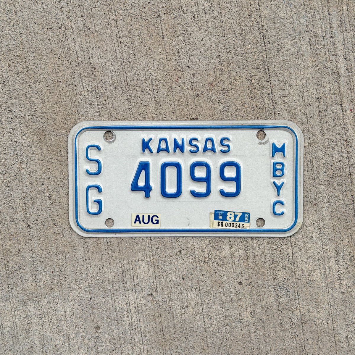 Photo of a 1982 1987 Kansas Moped License Plate Auto Tag Garage Decor Vintage SG 4099 with original patina
