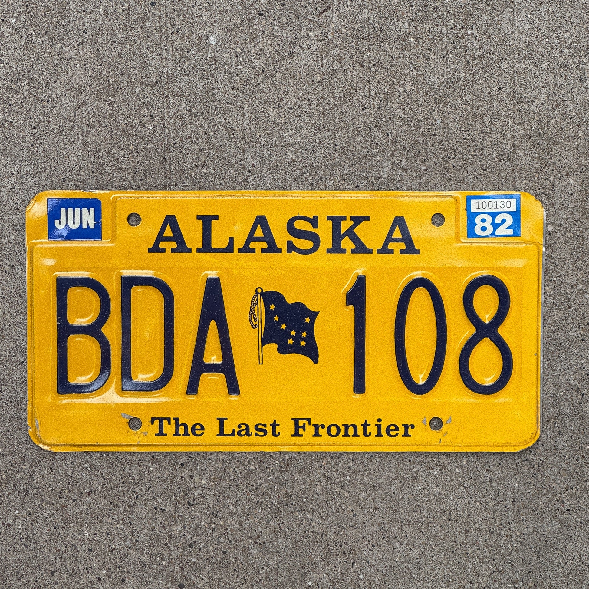Photo of a 1982 Alaska License Plate Auto Tag Garage Decor Vintage Natural 1982 Sticker BDA 108 with original patina