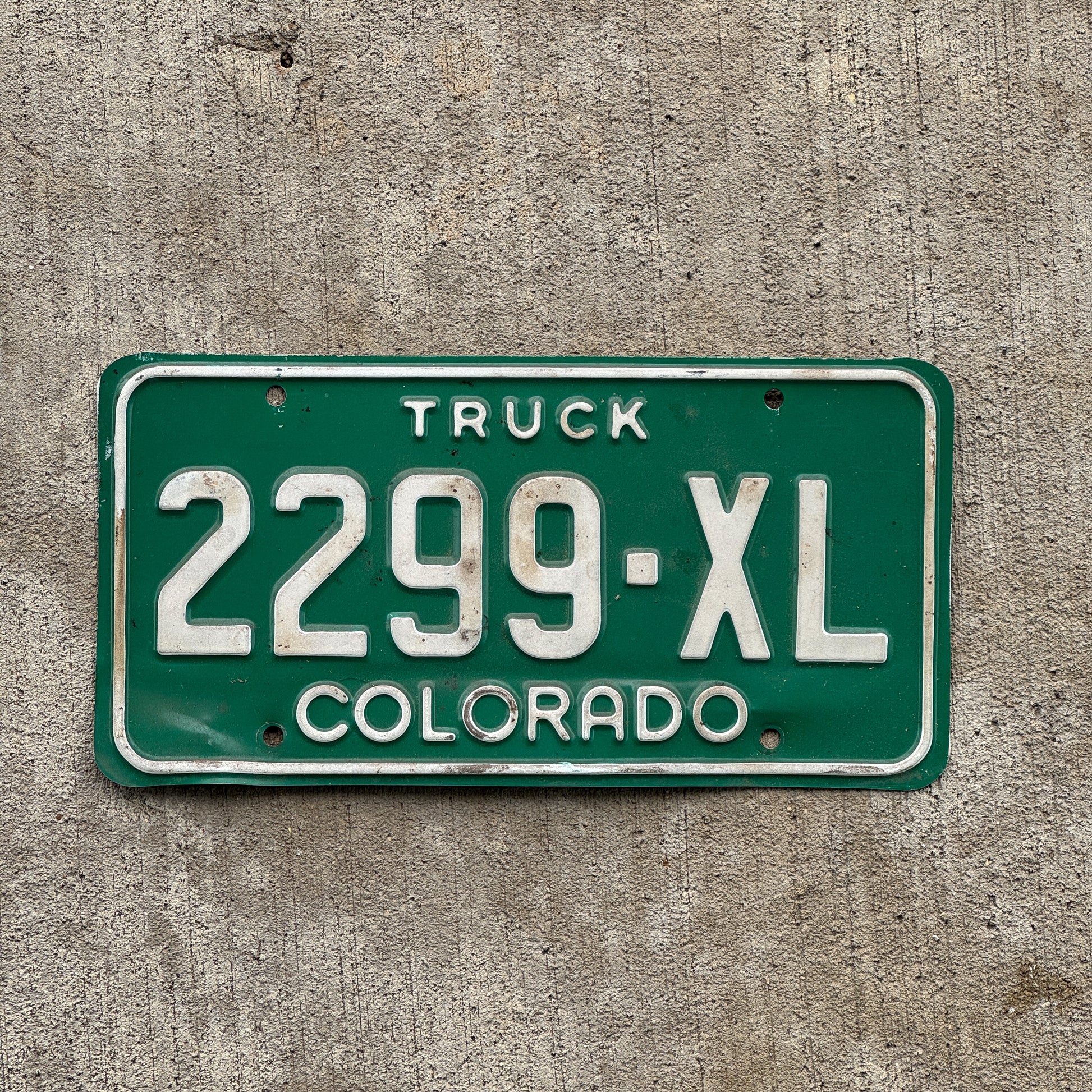 Photo of a 1982 Colorado Truck License Plate Auto Tag Garage Decor Vintage 2299 XL with original patina