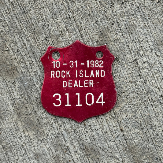 Photo of a 1982 Illinois Dealer Tax Tag License Plate Auto Tag Garage Decor Vintage Badge 31104 with original patina