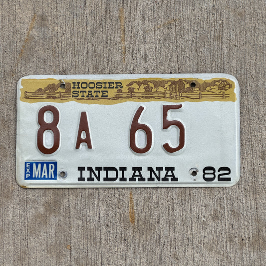 Photo of a 1982 Indiana License Plate Auto Tag Garage Decor Vintage Carroll County Low Number 8 A 65 with original patina
