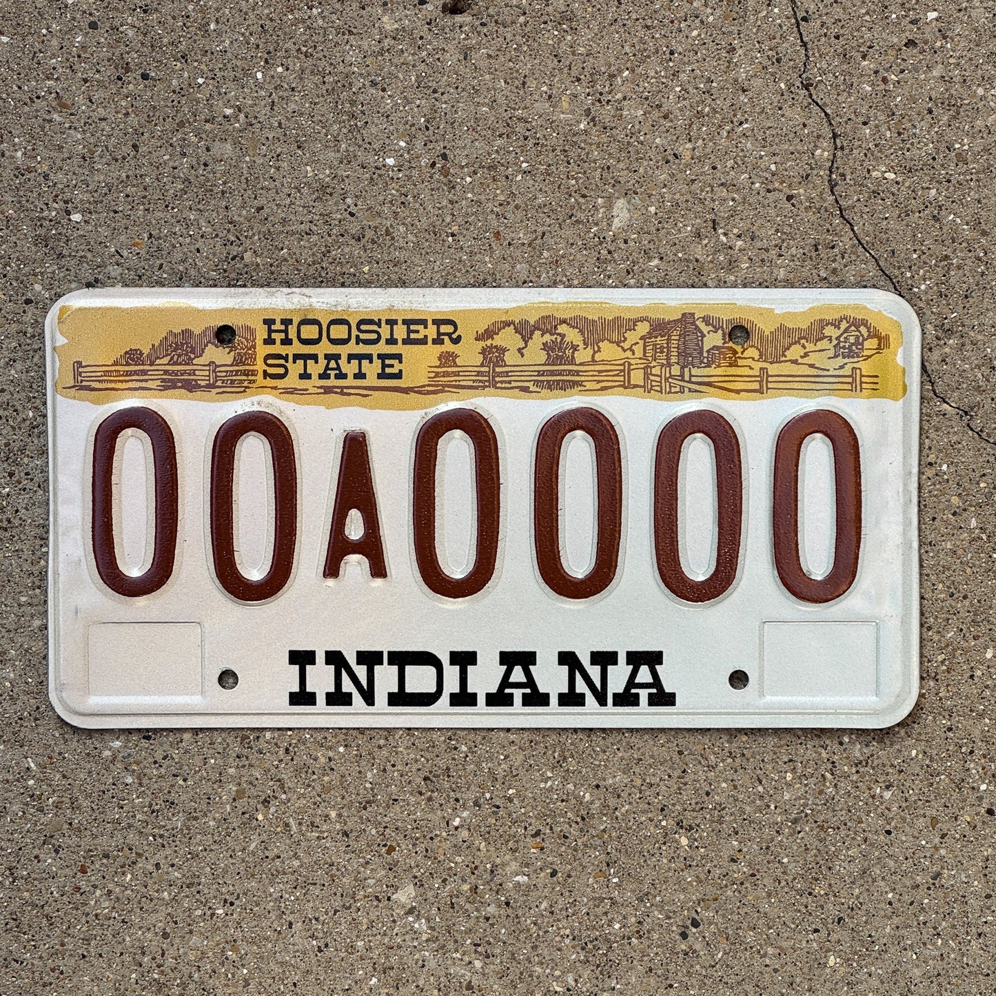 Photo of a 1982 Indiana Sample License Plate Auto Tag 3 Vintage 00A0000 with original patina