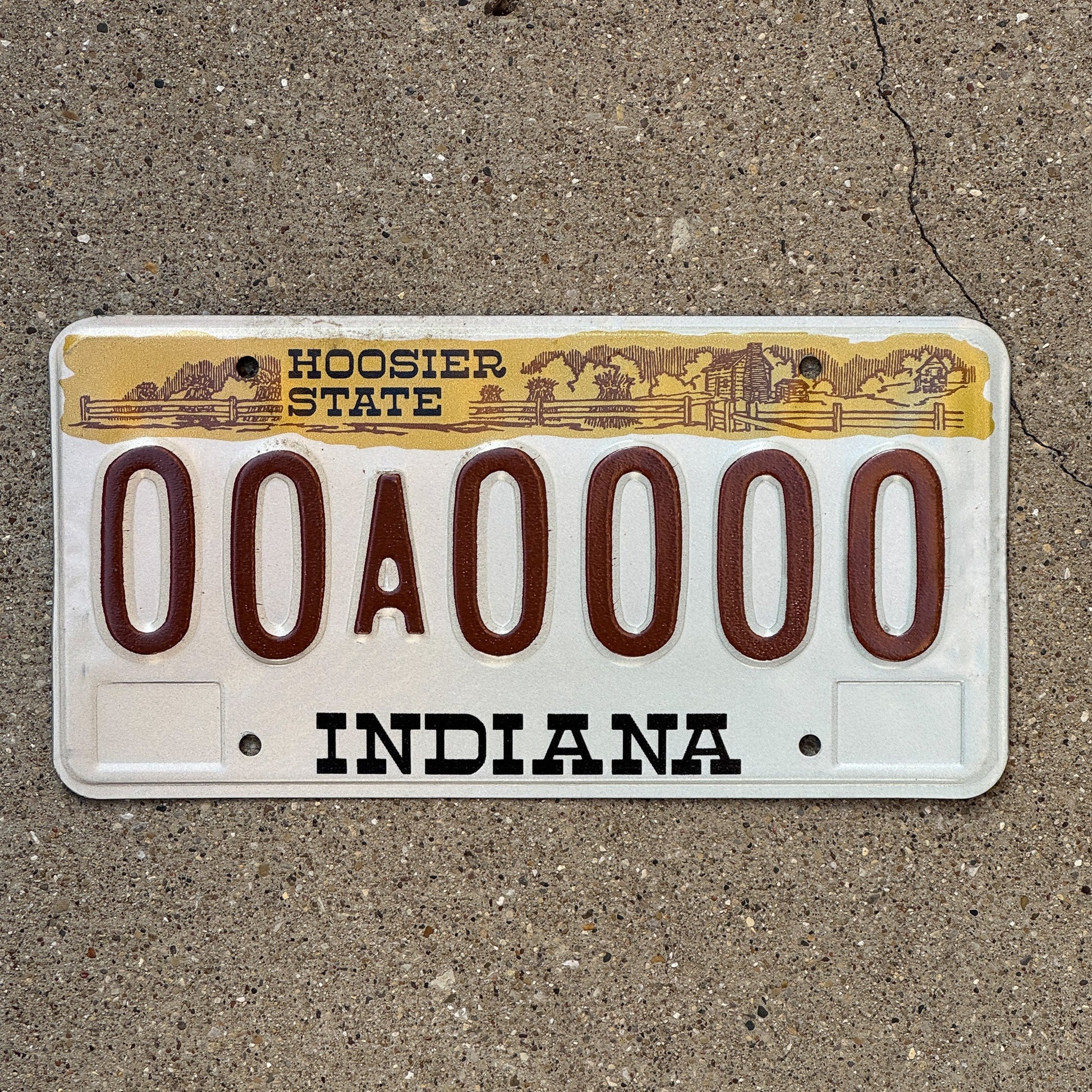 Photo of a 1982 Indiana Sample License Plate Auto Tag 3 Vintage 00A0000 with original patina