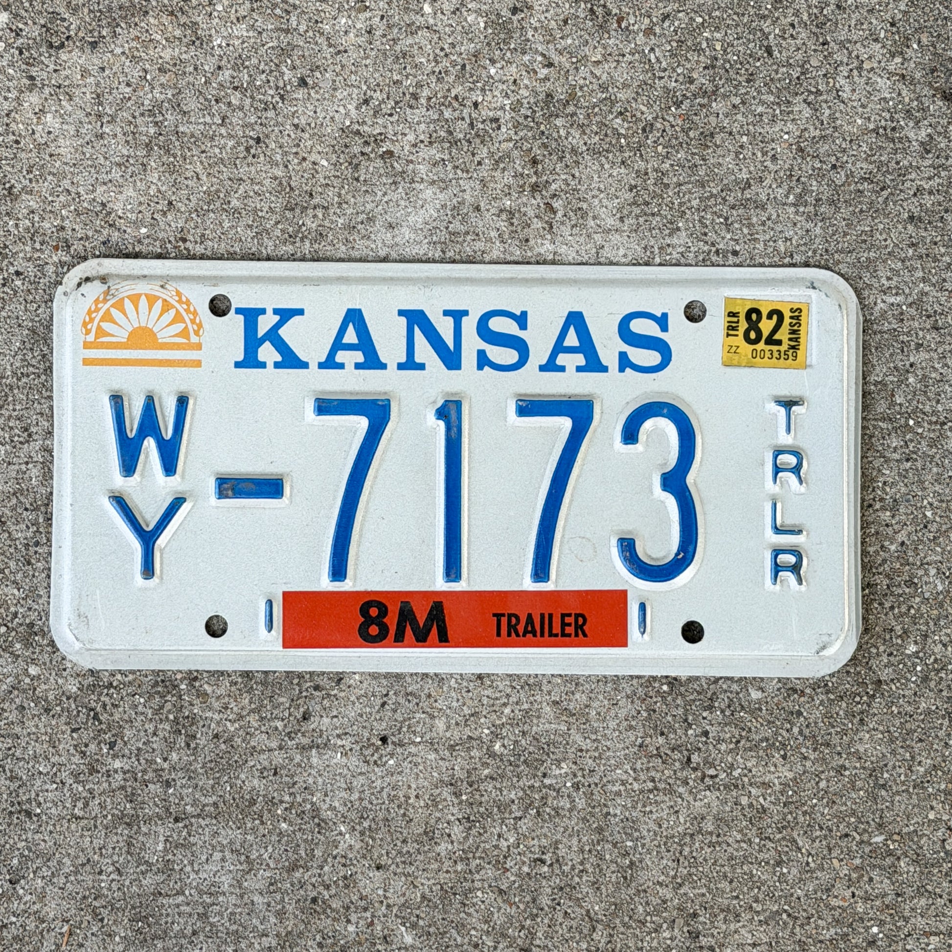 Photo of a 1982 Kansas Trailer License Plate Auto Tag Garage Decor Vintage WY 7173 with original patina