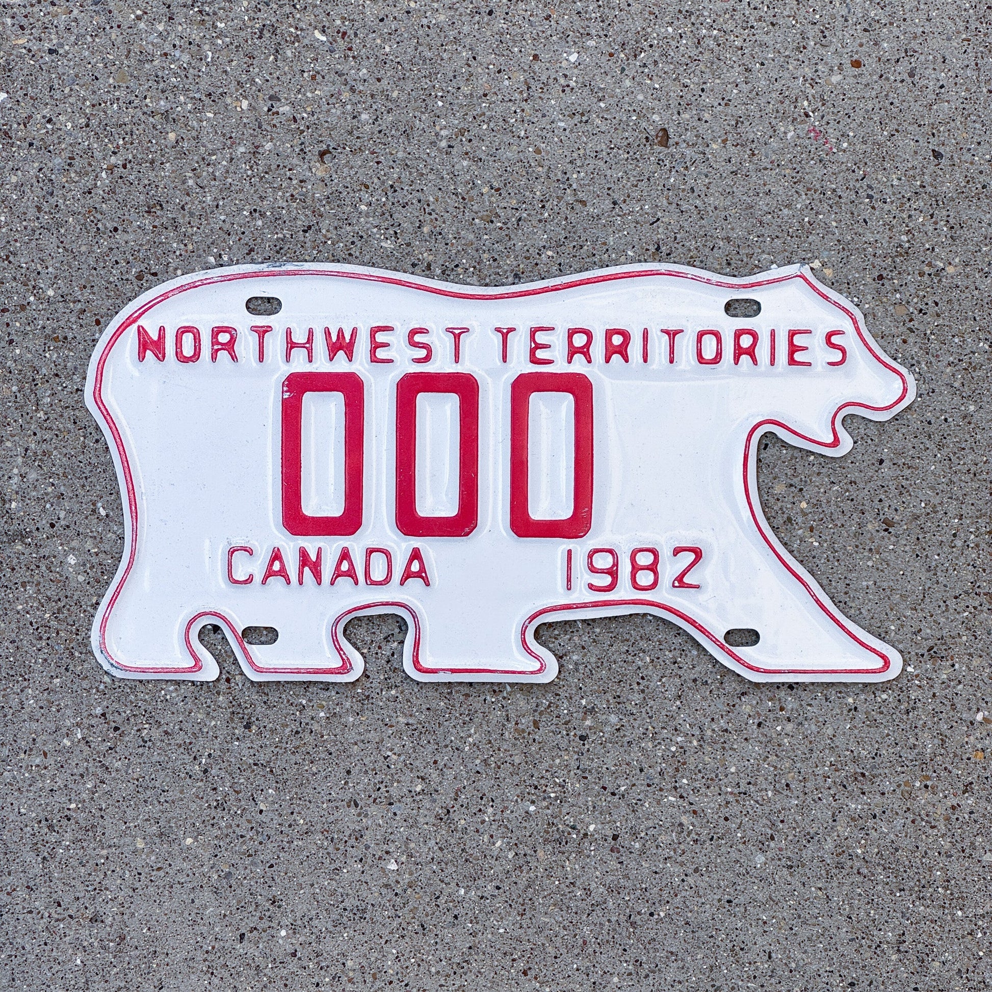 Photo of a 1982 Northwest Territories Sample License Plate Auto Tag Garage Decor Vintage Polar Bear 000