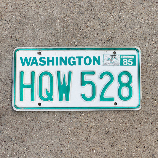 Photo of a 1983 1985 Washington License Plate Auto Tag Garage Decor Vintage DMV Clear Number HQW 528 with original patina