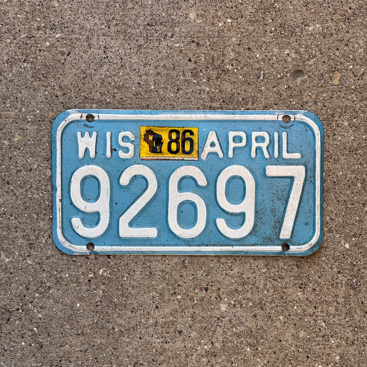 Photo of a 1983 1986 Wisconsin Motorcycle License Plate Auto Tag Garage Decor Vintage 92697 with original patina