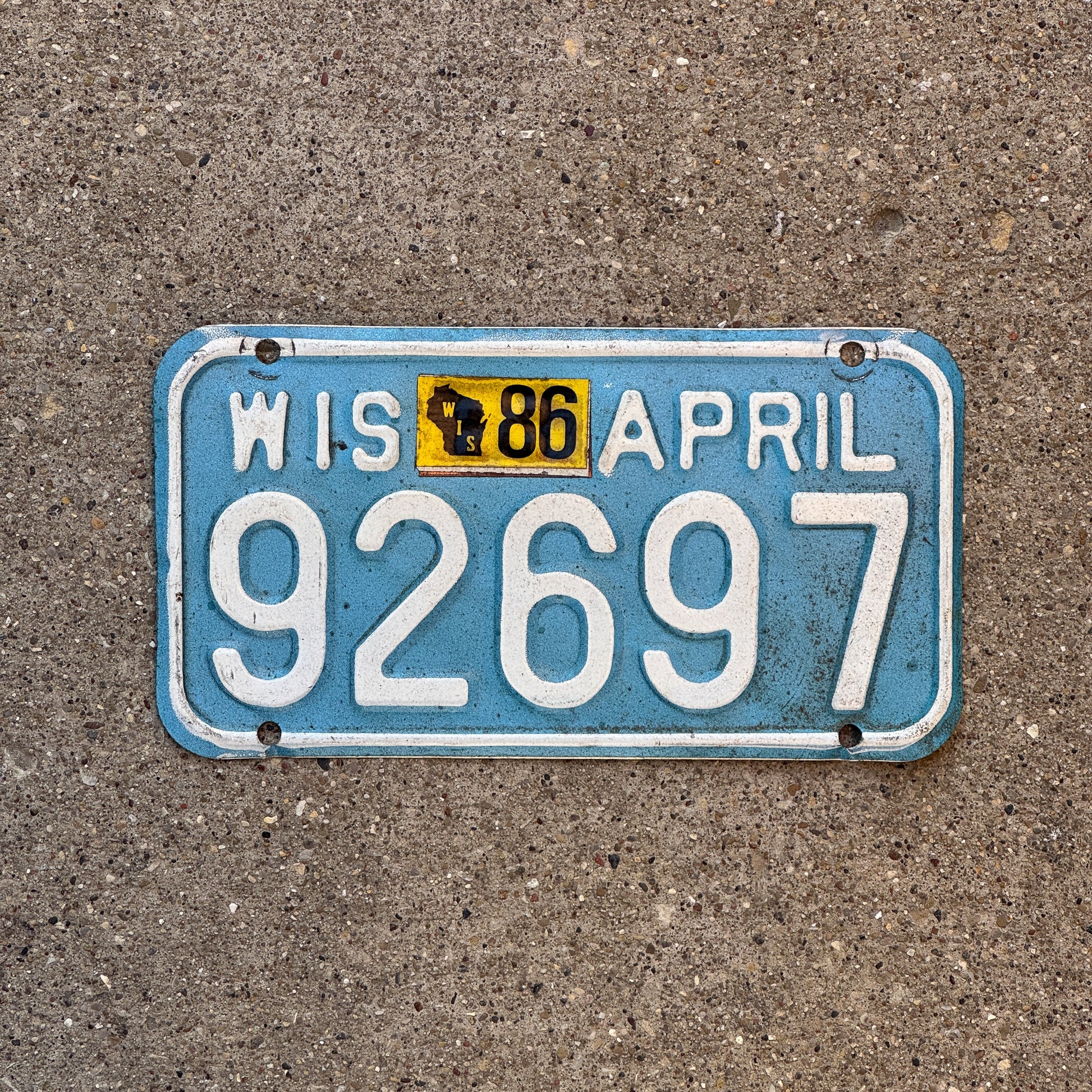 Photo of a 1983 1986 Wisconsin Motorcycle License Plate Auto Tag Garage Decor Vintage 92697 with original patina