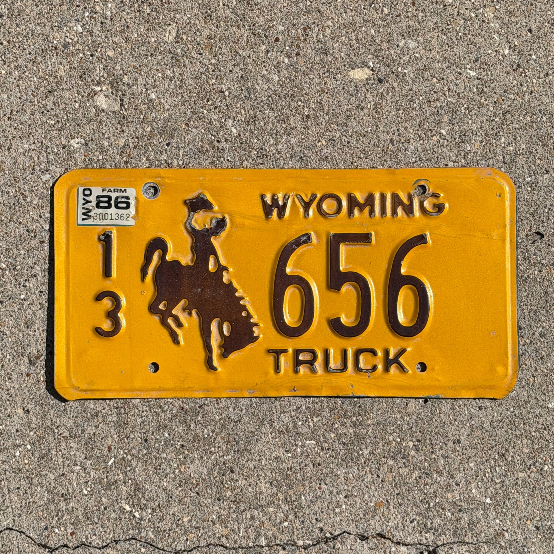 Photo of a 1983 1986 Wyoming Truck License Plate Auto Tag 1 Vintage Cowboy Rodeo 13 656 with original patina