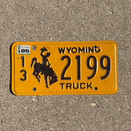Photo of a 1983 1986 Wyoming Truck License Plate Auto Tag Garage Decor Vintage Cowboy Rodeo 13 2199 with original patina