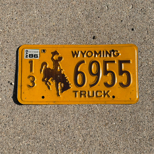 Photo of a 1983 1986 Wyoming Truck License Plate Auto Tag Garage Decor Vintage Cowboy Rodeo 13 6955 with original patina