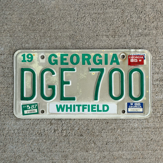 Photo of a 1983 1987 Georgia License Plate Auto Tag Garage Decor Vintage DGE 700 with original patina
