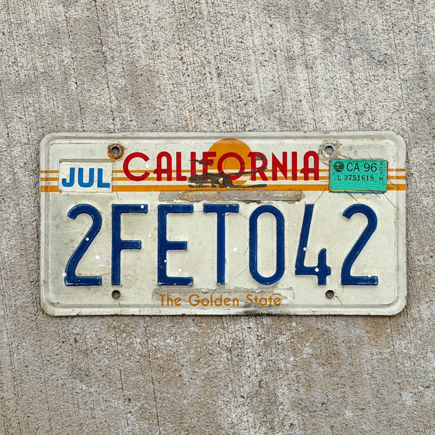 Photo of a 1983 1996 California License Plate Auto Tag Garage Decor Vintage Golden State Sunset 2 FET 042 with original patina