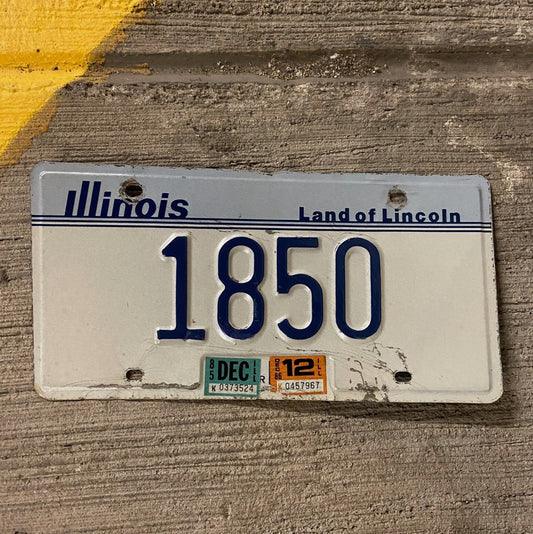 Photo of a 1983 86 Illinois License Plate Auto Tag Garage Decor Vintage Low Number Four Digit 1850 with original patina