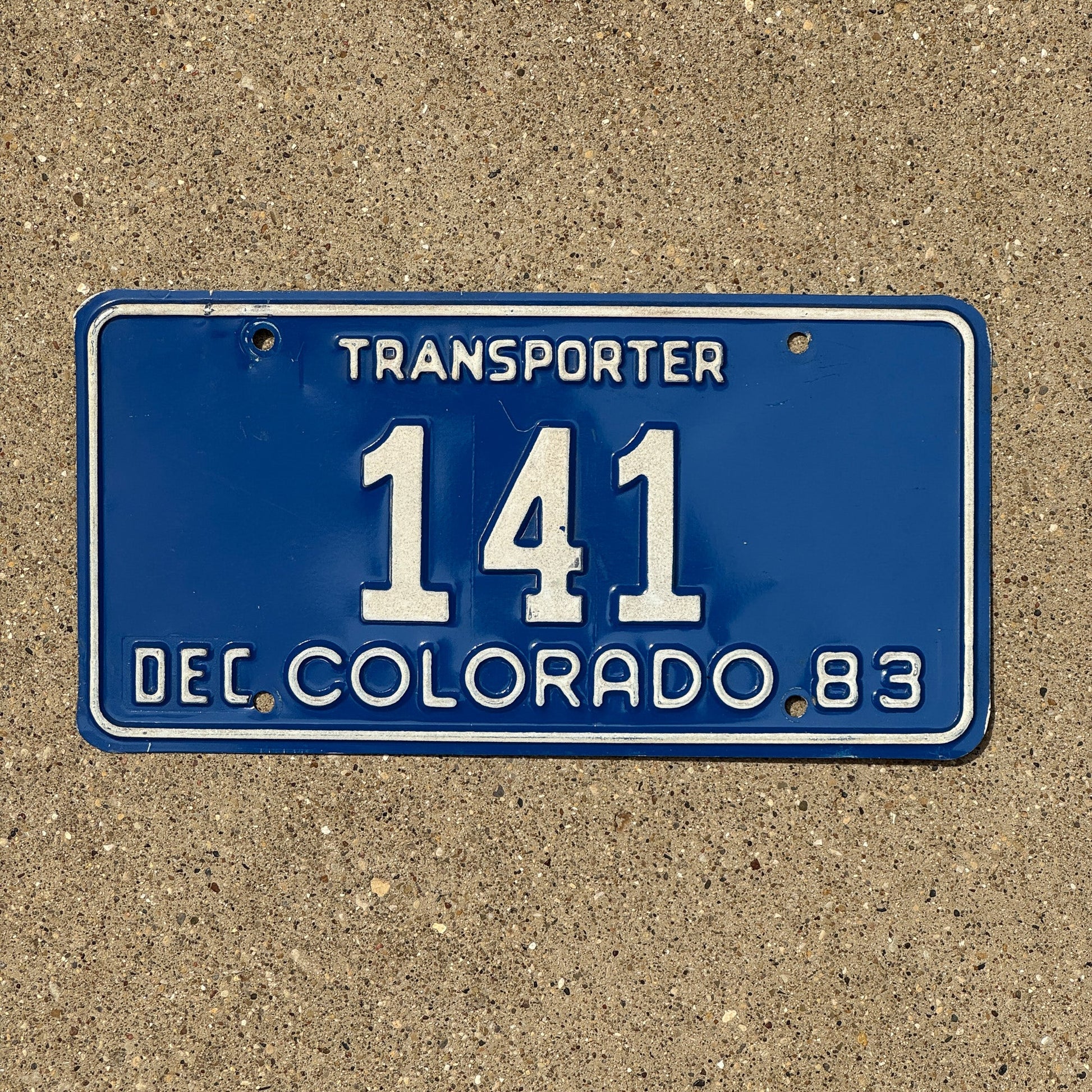 Photo of a 1983 Colorado Transporter License Plate Auto Tag Garage Decor Vintage 141