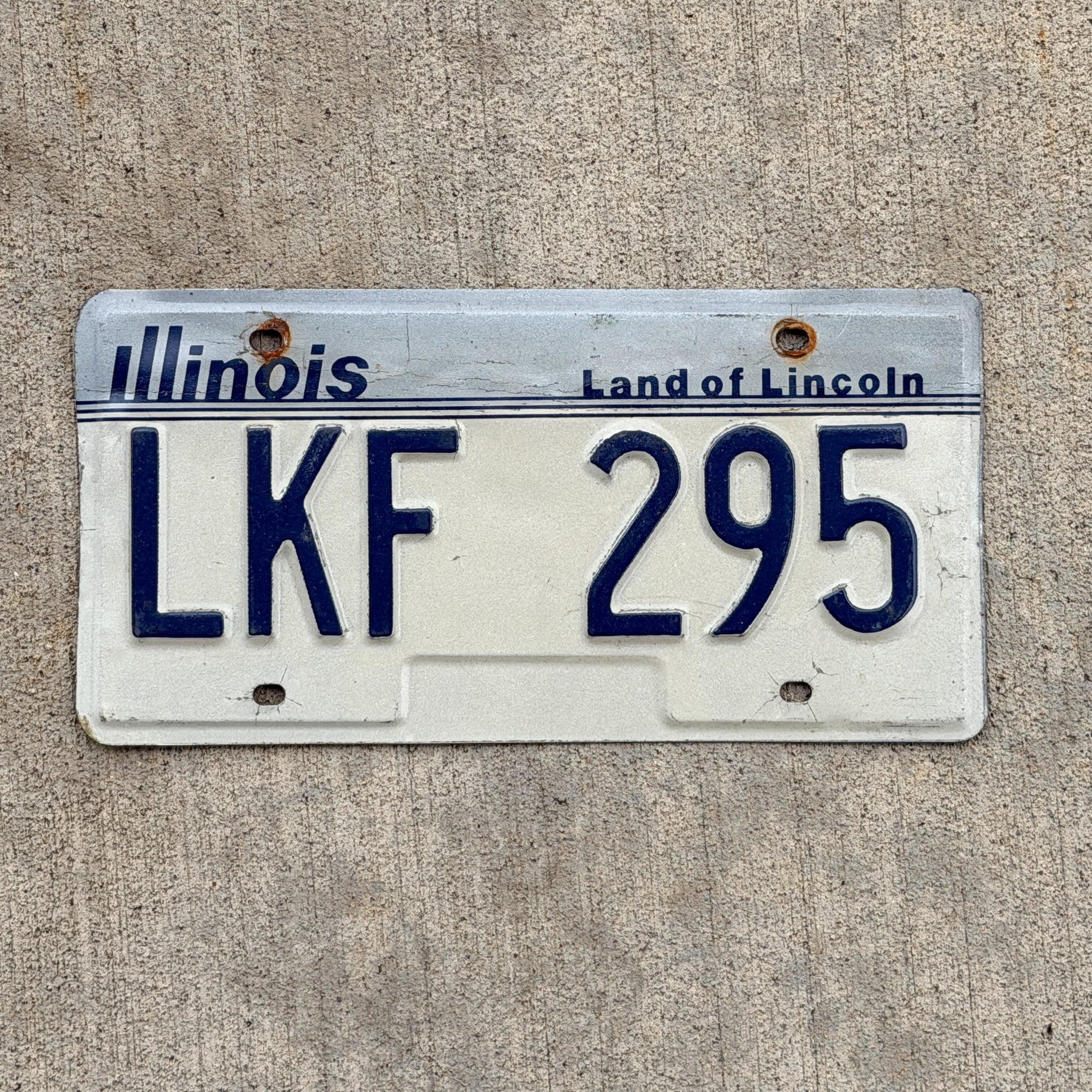 Photo of a 1983 Illinois License Plate Auto Tag Garage Decor Vintage LKF 295 with original patina