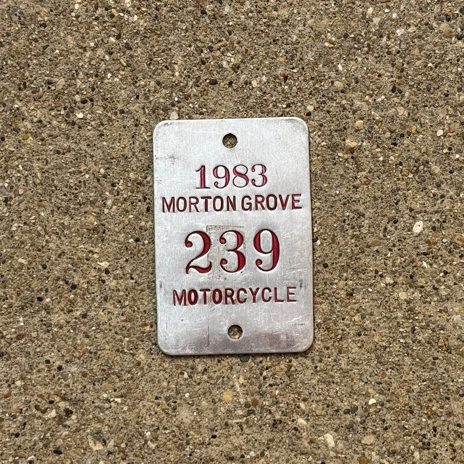Photo of a 1983 Illinois Motorcycle Tax Tag Auto Tag Garage Decor Vintage Morton Grove 239