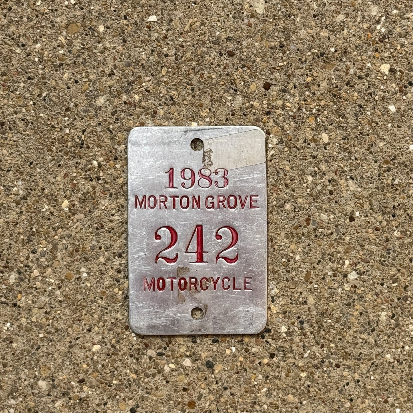Photo of a 1983 Illinois Motorcycle Tax Tag Auto Tag Garage Decor Vintage Morton Grove 242