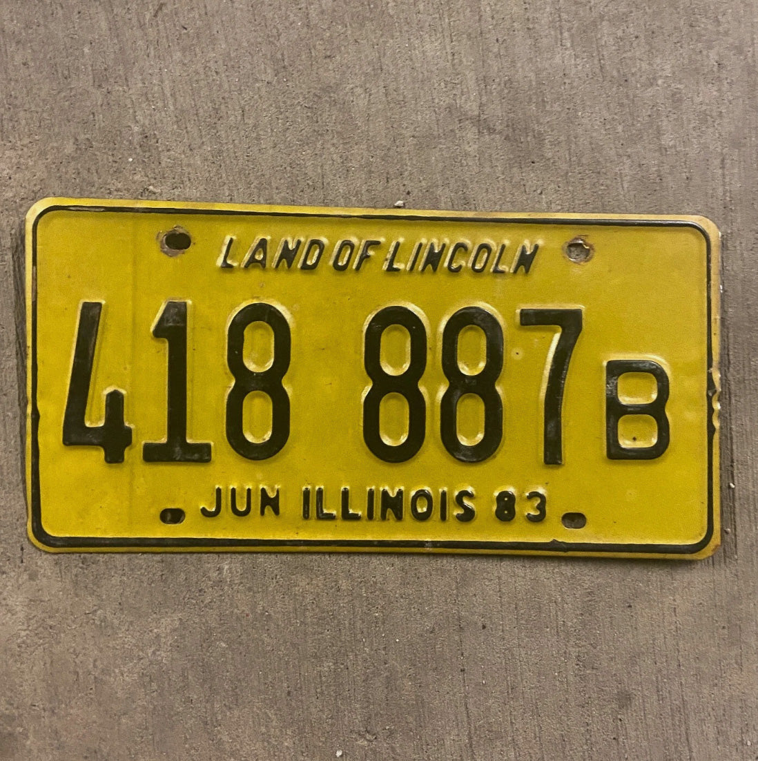 Photo of a 1983 Illinois Truck License Plate Auto Tag Garage Decor Vintage 418 887 B