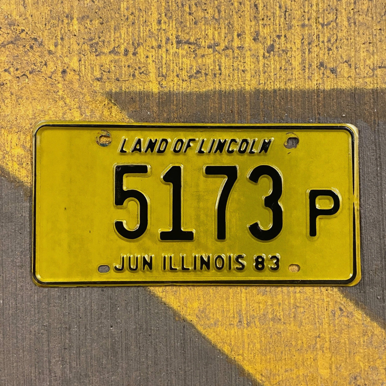 Photo of a 1983 Illinois Truck License Plate Auto Tag Garage Decor Vintage 5173 P with original patina
