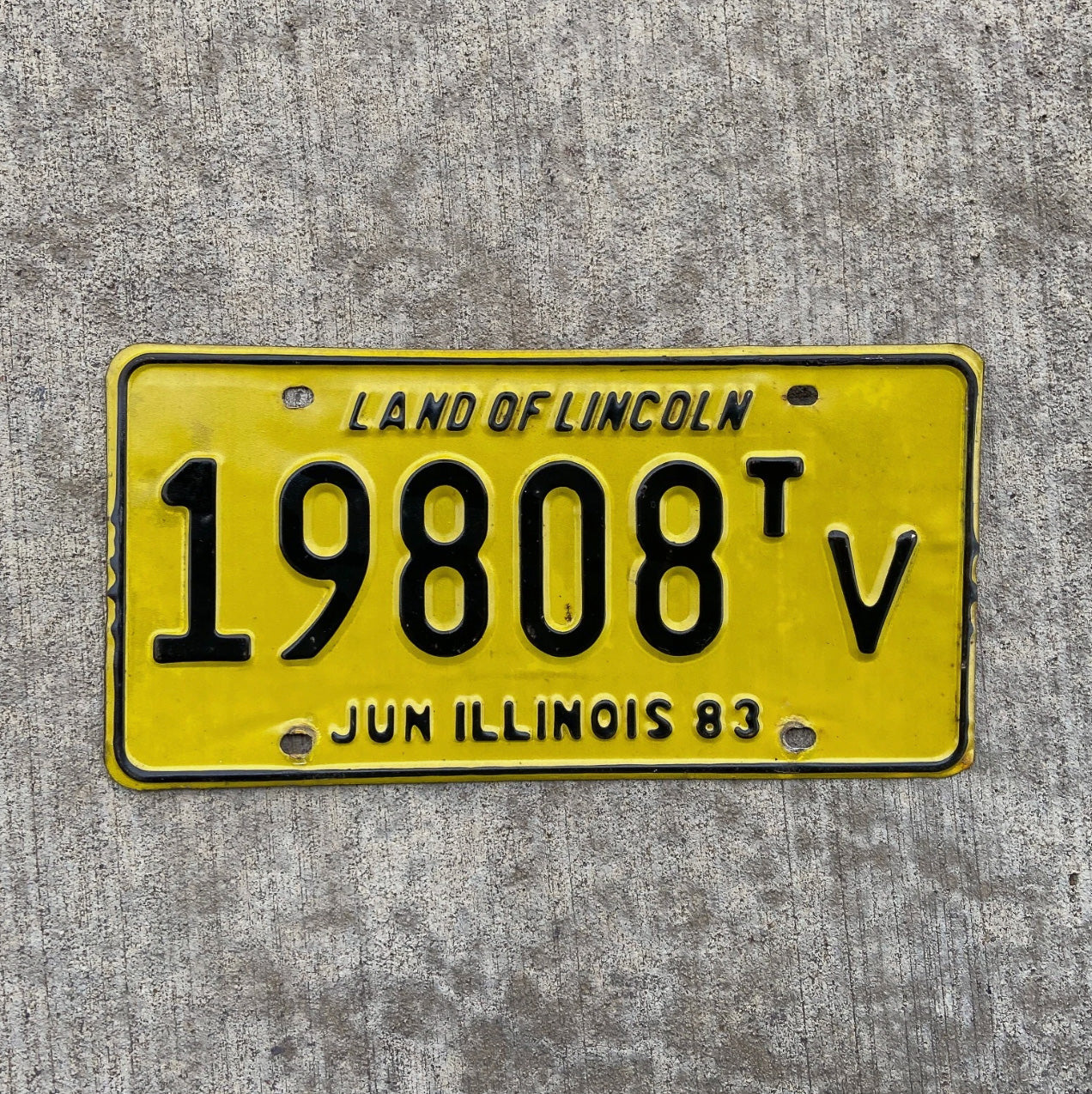 Photo of a 1983 Illinois Truck Tractor License Plate Auto Tag Garage Decor Vintage 19808 TV with original patina