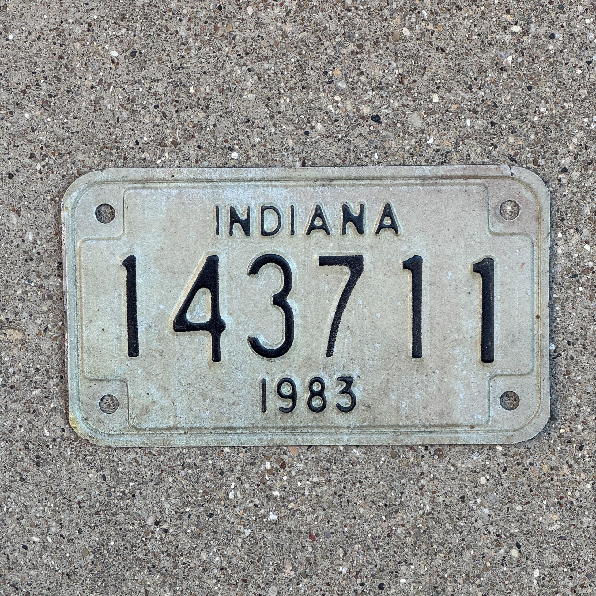 Photo of a 1983 Indiana Motorcycle License Plate Auto Tag Garage Decor Vintage 143711 with original patina