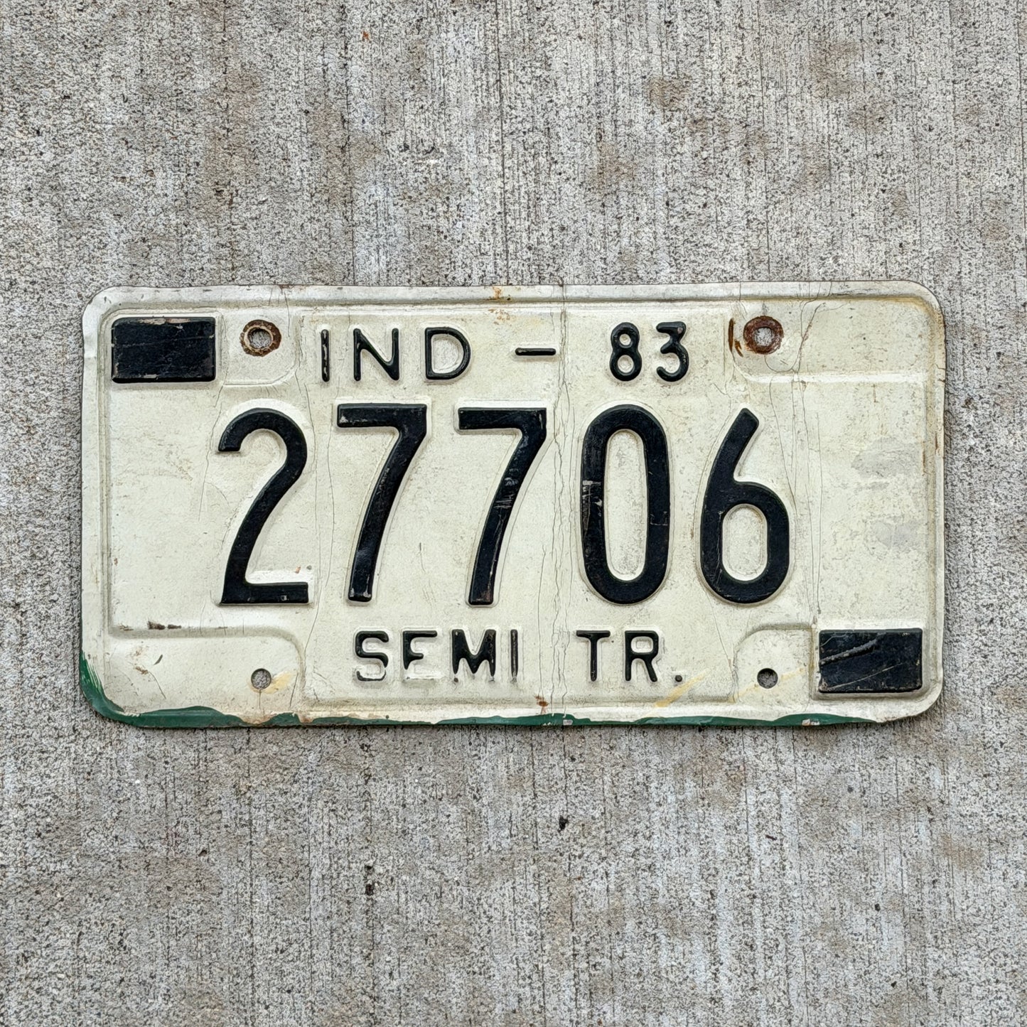 Photo of a 1983 Indiana Semi Trailer License Plate Auto Tag Garage Decor Vintage 27706 with original patina