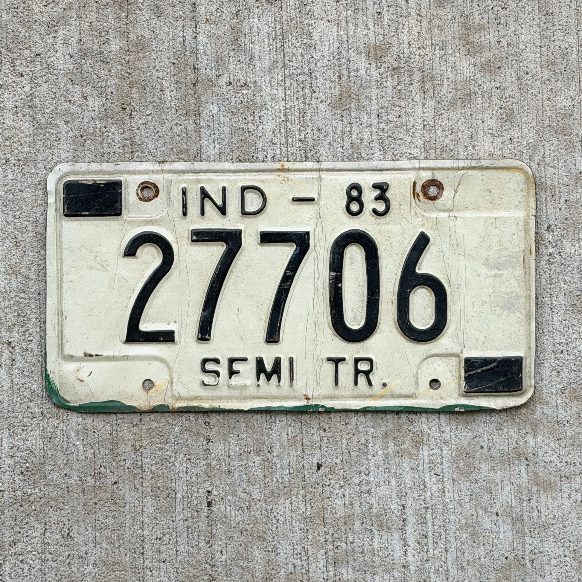 Photo of a 1983 Indiana Semi Trailer License Plate Auto Tag Garage Decor Vintage 27706 with original patina