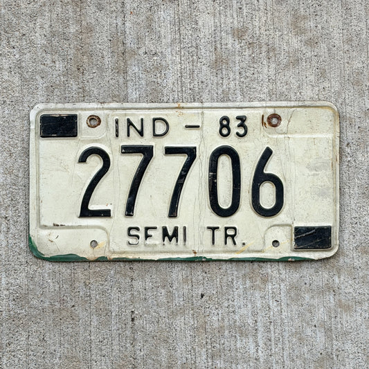 Photo of a 1983 Indiana Semi Trailer License Plate Auto Tag Garage Decor Vintage 27706 with original patina