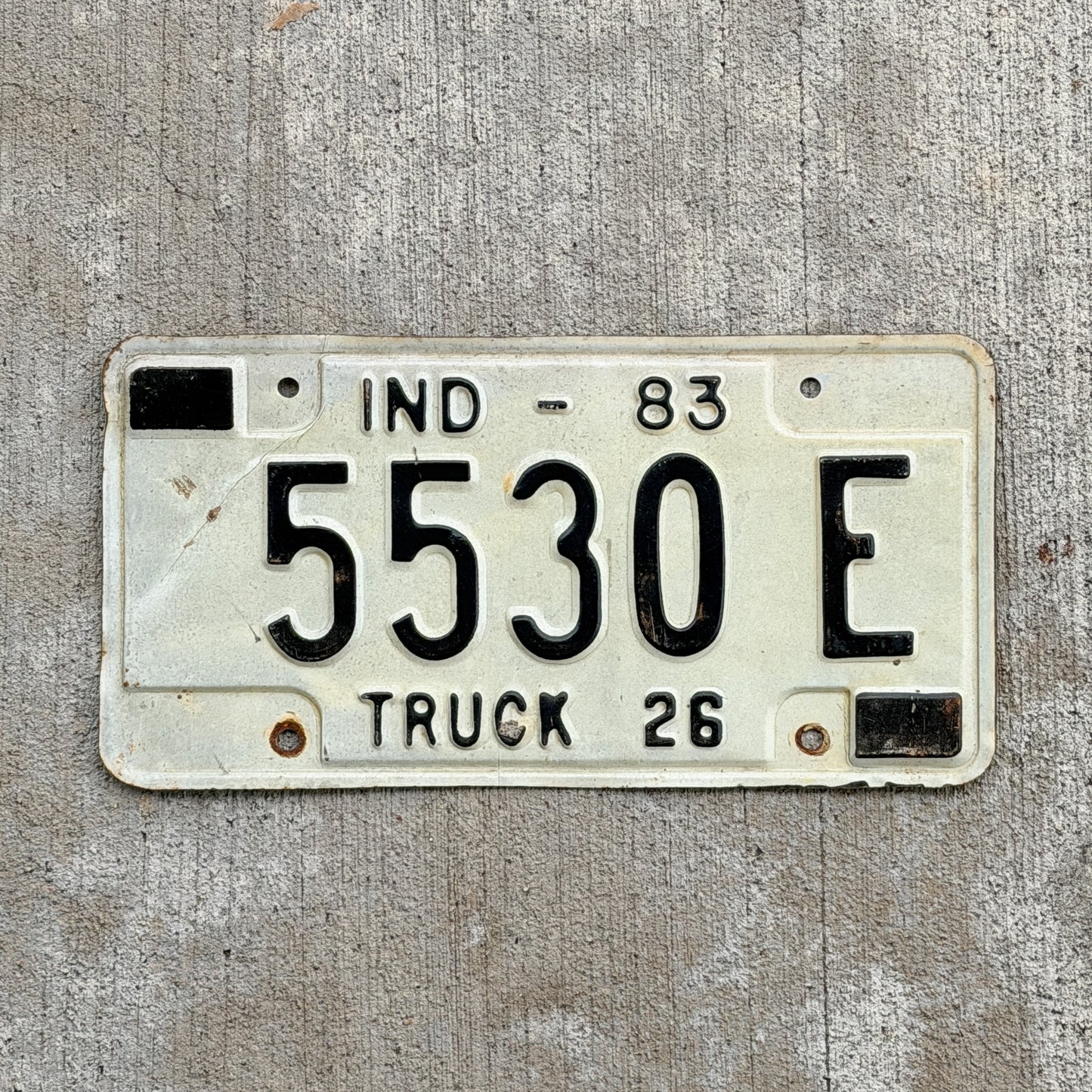 Photo of a 1983 Indiana Truck License Plate Auto Tag Garage Decor Vintage 5530 E with original patina